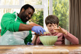 Baking together with a mixing bowl at a flour-dusted table at Westholme