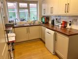 Kitchen at Chesterwood with cream units, wooden worktops and a dishwasher