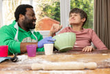 Baking session with a green mixing bowl and rolling pin at a flour-dusted table at The Willows