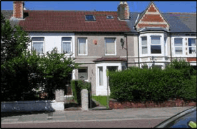 Street view of Thompson Court, a mid-terrace house with a tiled roof, bay window and front garden