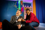 Sensory room with a green bubble tube and colourful hanging decorations at Westholme