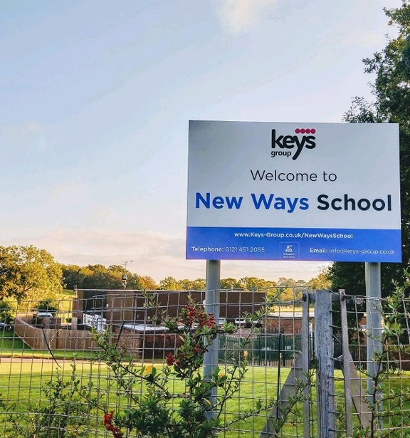 Welcome to New Ways School sign with Keys Group logo at the school grounds entrance