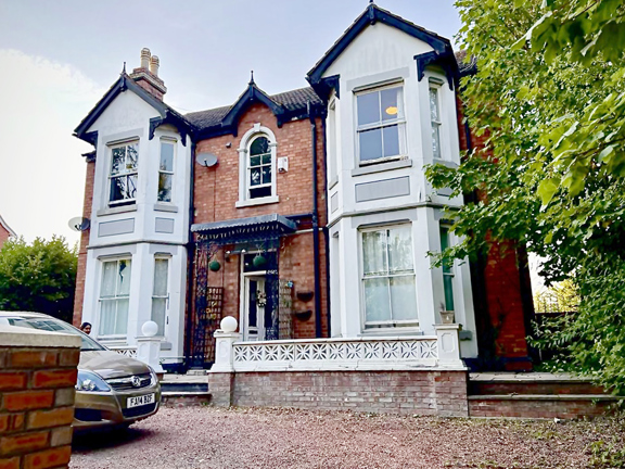 Victorian style double fronted 2 story home built with red brick .