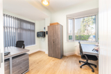 Office at Church Road with desks, office chairs and a storage cupboard