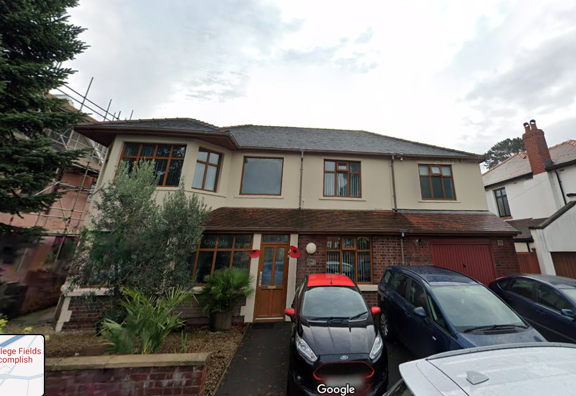 Street-view exterior of College Fields, a large detached house with cars parked on the driveway