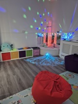 Sensory room at Crown House with a bubble tube, fibre-optic lights and soft beanbags